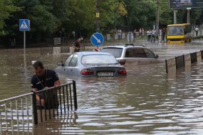The machines are driven by a flooded street
