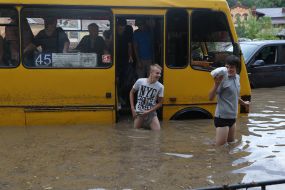 A minibus on a flooded street