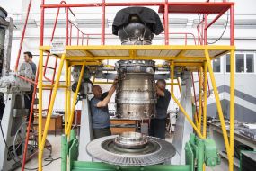 Employees of Lutsk Repair Plant "Motor" near the equipment