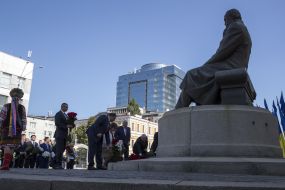 Laying flowers at the monument to Mikhail Hrushevsky