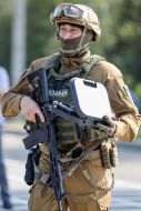 The law guard holds the reward weapon