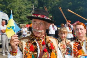 A participant of the festive procession in the national Hutsul costume