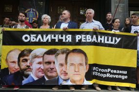 Representatives of the Youth Nationalist Congress hold a poster