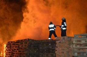 Rescuers work at the place of fire