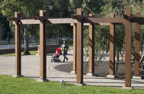A woman with a stroller walks in the park "Natalka"