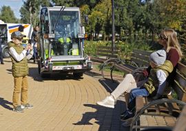 The boy takes pictures of his mother