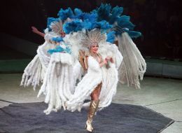 Circus dancers in white costumes