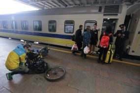 Passengers near the train carriage