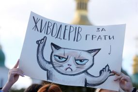 A poster with a drawn cat during