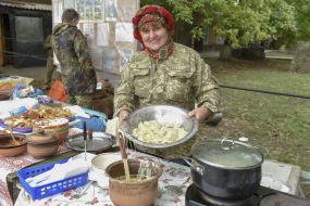 Volunteer with a dumpling bowl