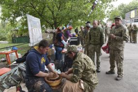 A military officer makes a clay product