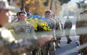 Laying flowers at the monument to fallen soldiers