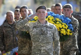 Laying flowers at the monument to fallen soldiers