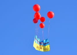 Flag of Ukraine on balloons in the sky