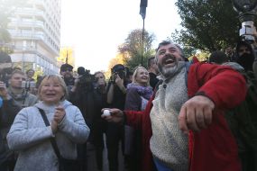 A participant in the "action on the decommissioning of Soviet idols" throws an egg