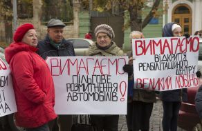 Participants of the action with posters near the Cabinet of Ministers of Ukraine