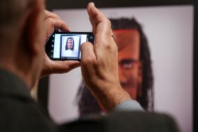 Visitor of the exhibition photographed with a photomontage