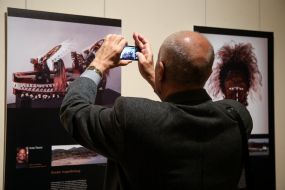 Visitor of the exhibition photographed with a photomontage