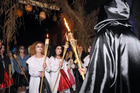 Participants ZombieFEST go with torches