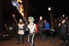 Participants ZombieFEST go with torches