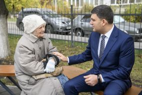 Vladimir Groysman communicates with a woman