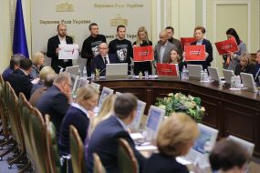 Deputies with posters "Who is the killers Katya Gandzyuk"