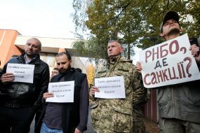 Participants hold posters