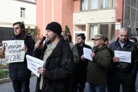 Participants hold posters