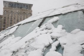 Snow-covered glass dome of TC "Globus" on Independence Square