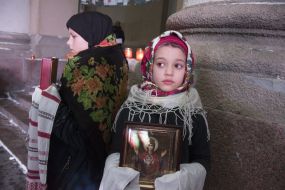 Girl holding an icon