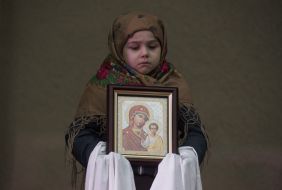 Girl holding an icon