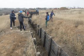 Pupils of the orphanage "Respublika Piligrim" near the trenches