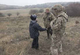 The pupil of the Children's Home "Republic Pilgrim" communicates with servicemen