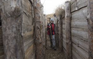 The pupil of the children's home "Respublika Piligrim" with a shovel in a trench