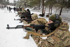 Participants of the training of the National Wives are firing from the machine guns at the training ground