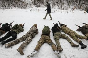 Participants of the training of the National Wives are firing from the machine guns at the training ground