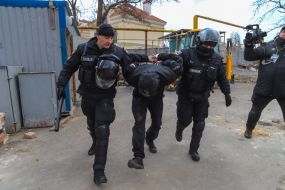 Police detain one of the participants of the fight