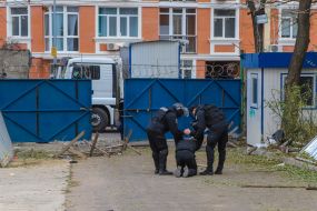 Police detain one of the participants of the fight