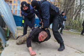 Police detain one of the participants of the fight