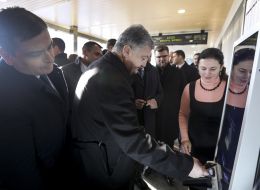 Petro Poroshenko buys a ticket at the box office