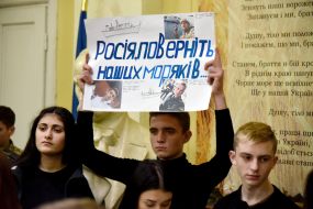 A student holds posters