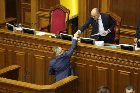 Volodymyr Kurin is congratulated with Andriy Parubius