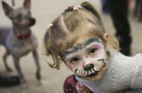 A girl with a water tank on her face