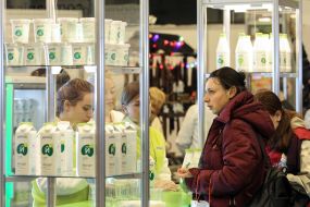 Woman at the counter with milk products