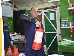 Lifeguard with a fire extinguisher at a festive fair