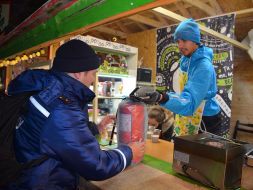 Lifeguard with a fire extinguisher at a festive fair