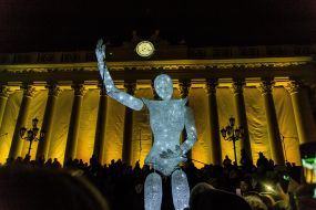 A light puppet on the background of a highlight of the building of the Odessa City Council