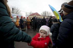 People listen to Peter Poroshenko's speech