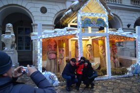 People are photographed near the Christmas shop