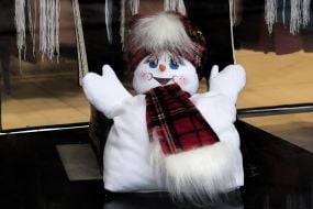 A snowman in a storefront